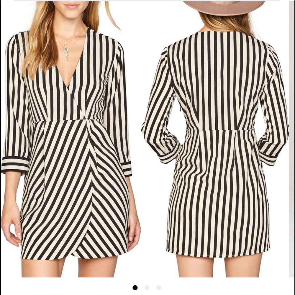 A faux-wrapped waist black-and-cream striped dress.